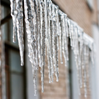icicles hanging down from a roof